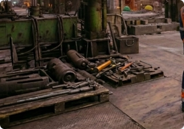 Presstrade technician performing maintenance on a forging machine