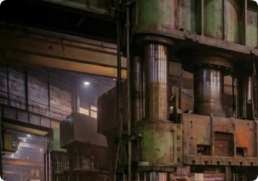 Presstrade technician performing maintenance on a forging machine